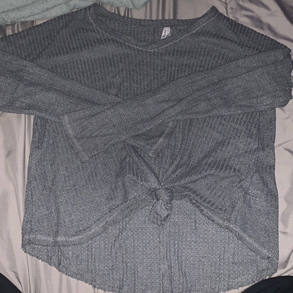vneck gray thin sweater; tied in front